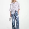 Von Hand bespritzte Jeans mit weitem Bein aus gebleichtem Denim Von Hand bespritzte Jeans mit weitem Bein aus gebleichtem Denim